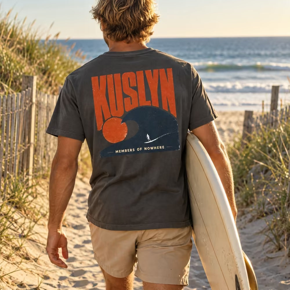 Members of Nowhere Wave Tee - Faded Black - back, worn on the beach